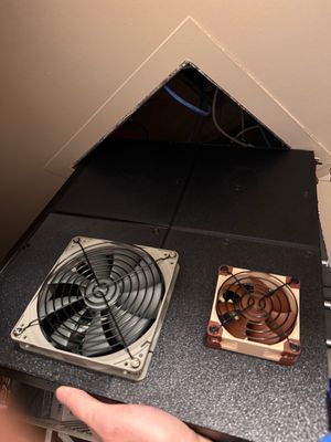 A photo of a hand holding a large networking switch diagonally against the opening of a ceiling access panel, demonstrating that the switch does not fit through the opening. Not pictured: a very disappointed man feeling foolish.